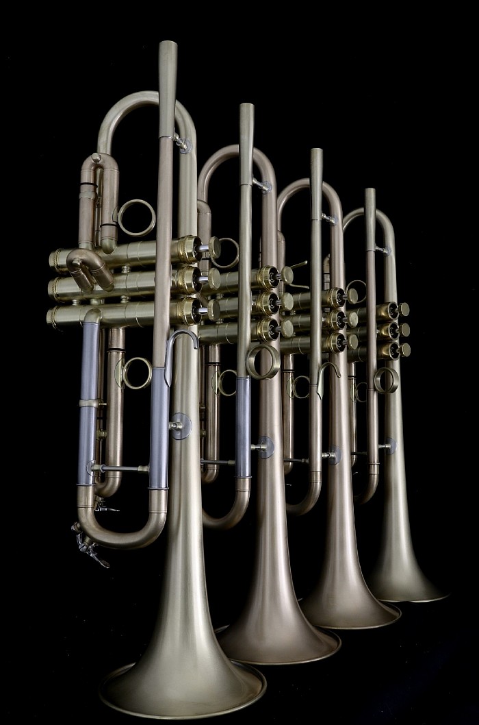 Four custom RBM (Red Brass Monster) Bb trumpets in different setups/materials